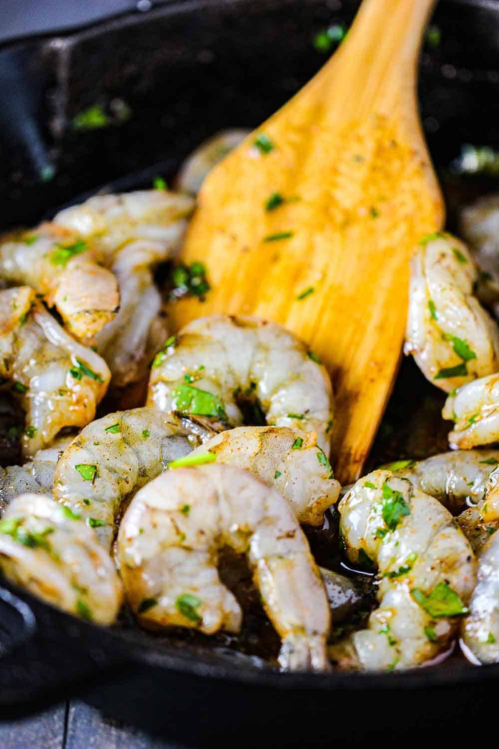 Stir the shrimp with a wooden spoon halfway through cooking.