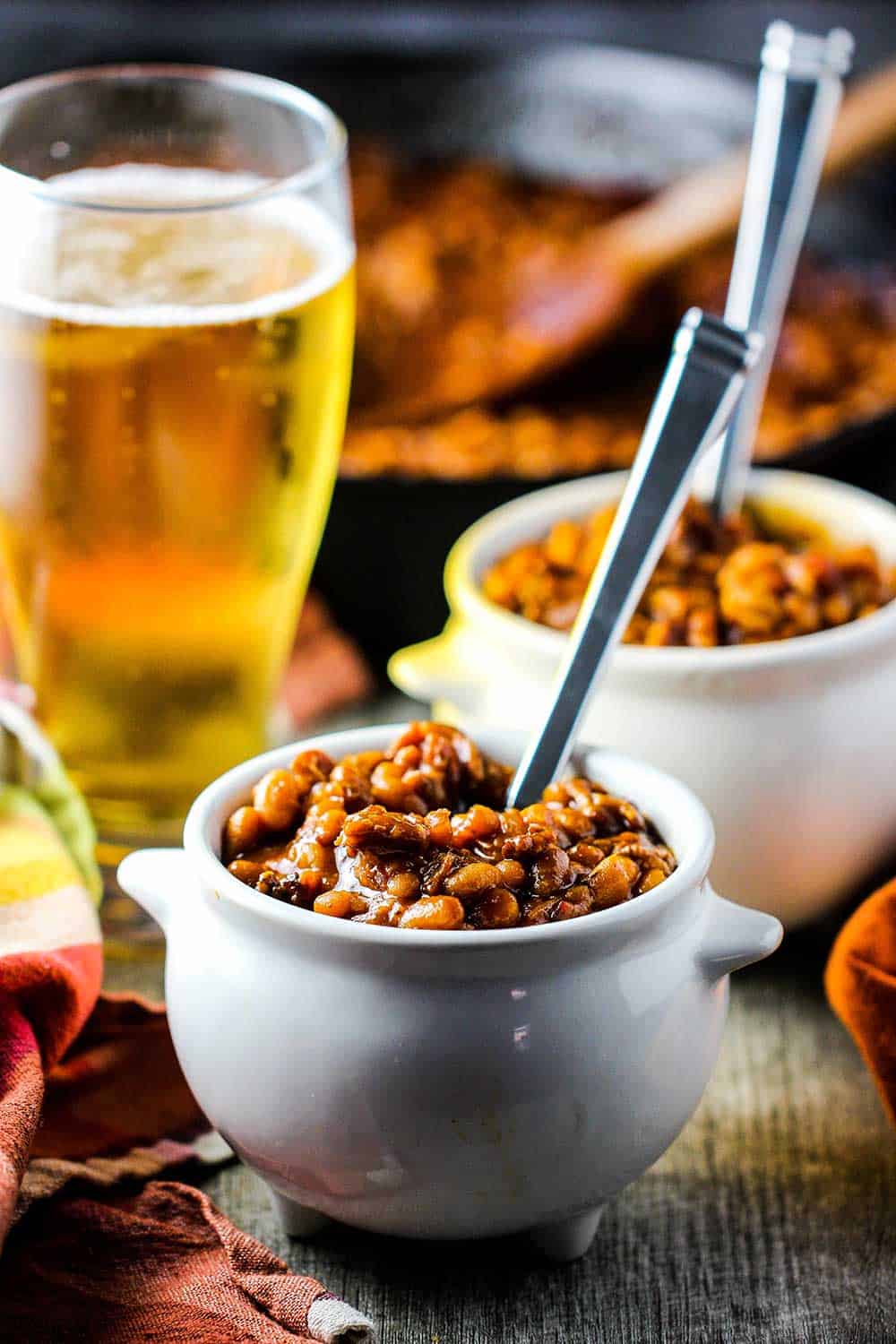 Southern Baked Beans are spooned into to crocks for eating next to a cold beer.