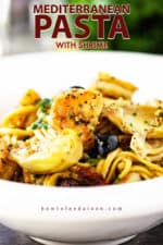A close-up view of a bowl filled with Mediterranean pasta.