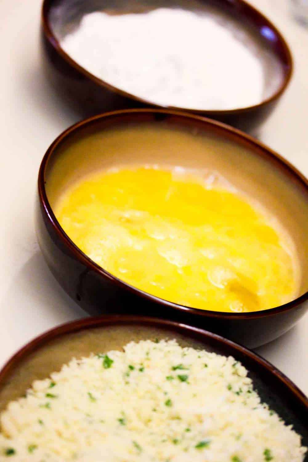 a dredge station for fried mozzarella of flour, eggs and breadcrumbs