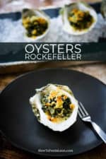 A small circular black plate with an oysters Rockefeller placed in the middle of it next to an oyster fork.