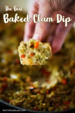 A hand holding up a toasted slice of bread topped with baked clam dip.