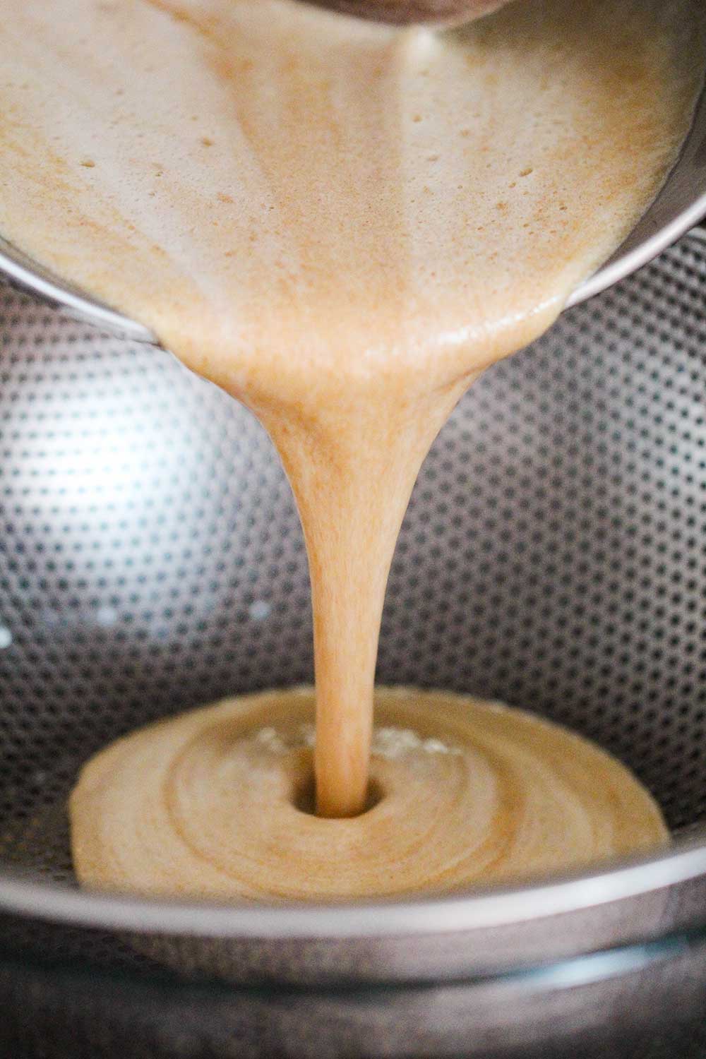 Strain the peanut butter custard through a sieve or colander.