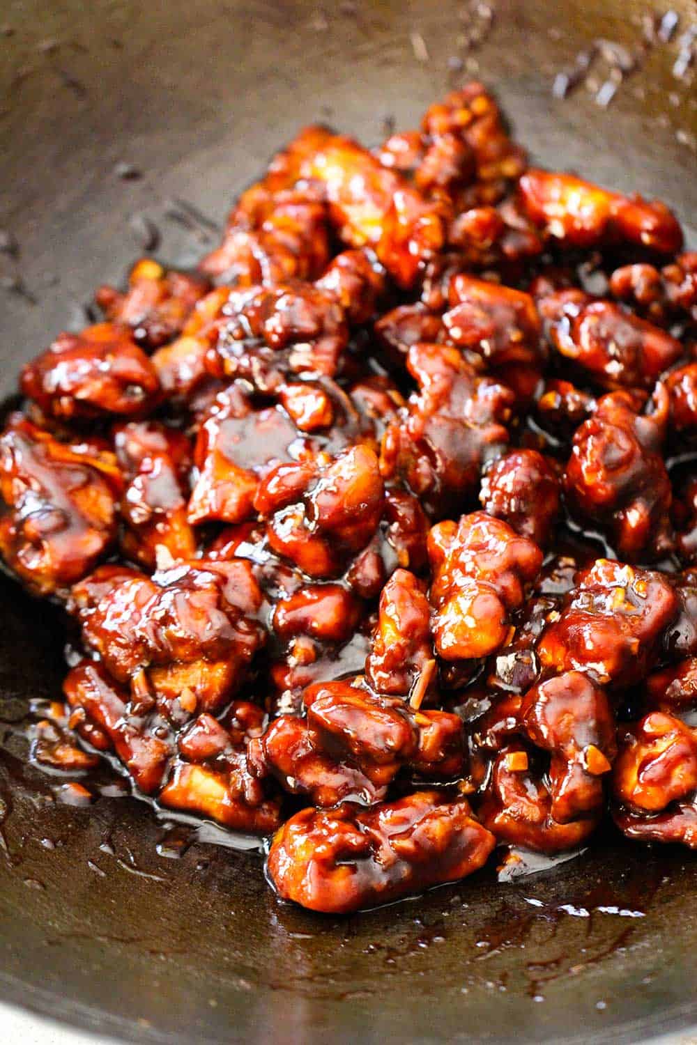 Cooked General Tso's chicken in a wok.
