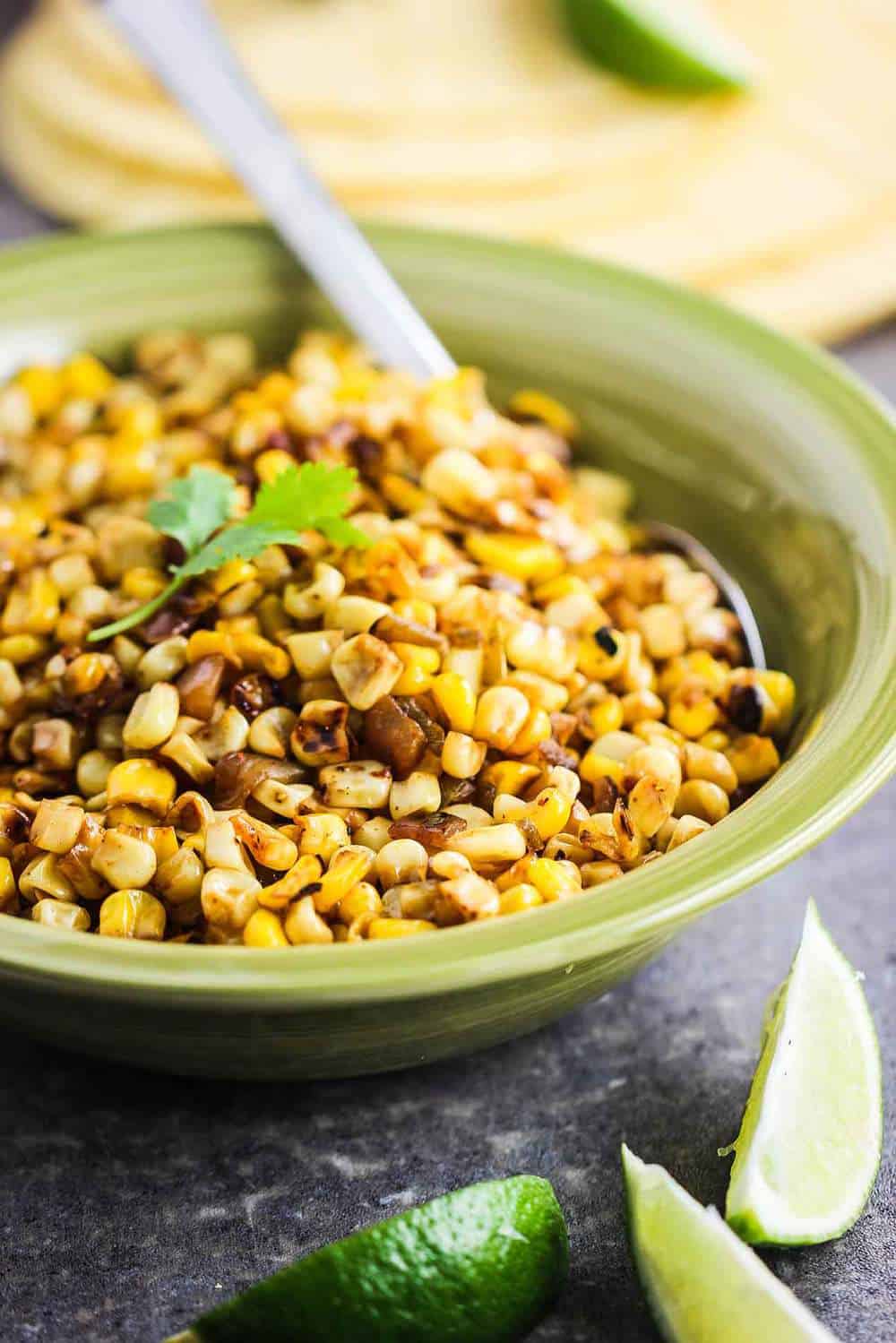 A bowl filled with roasted corn salsa