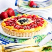 classic fruit tart on floral place mat
