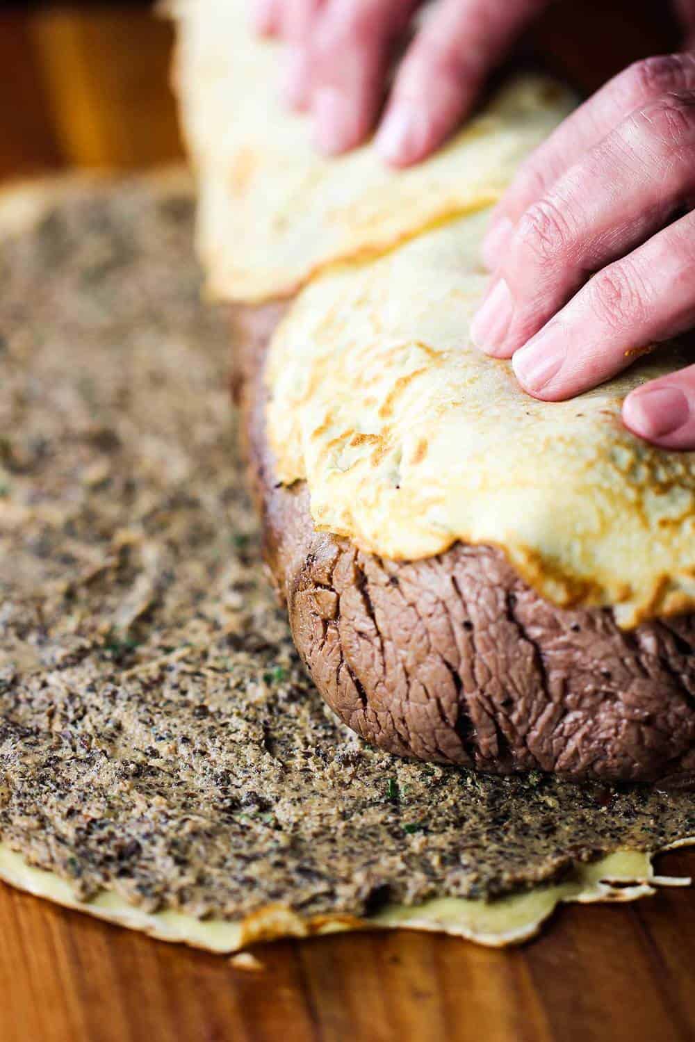 Rolling the classic beef Wellington