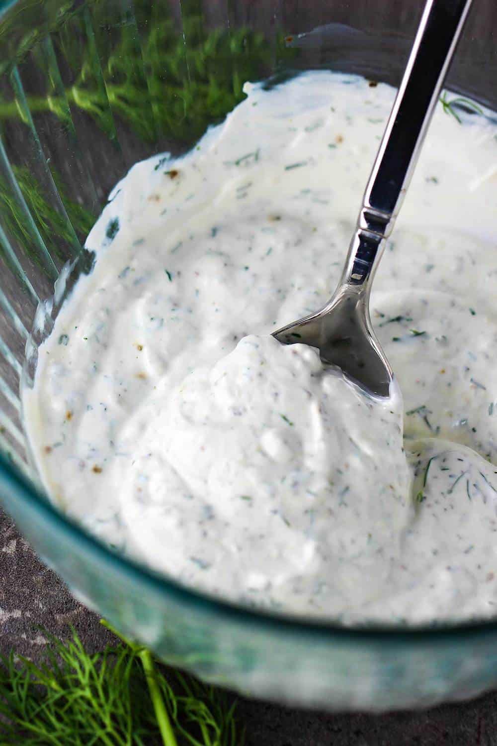 Dill dressing in a glass bowl for beet and potato salad