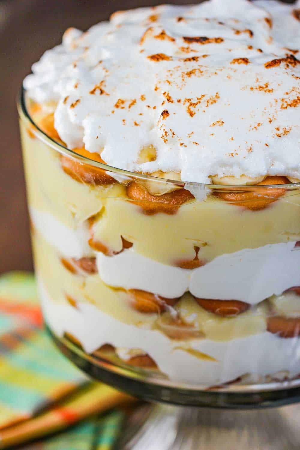 Banana Pudding Trifle with Meringue on a wood table.
