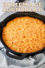A black cast iron skillet of homemade cornbread.
