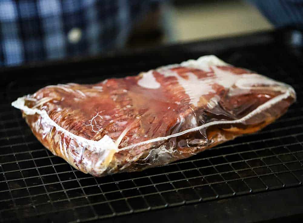 A package filled with cooked Wagyu chuck short ribs.