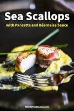 A pancetta-wrapped scallop that has been split open and is sitting in a yellow egg and wine sauce.