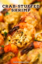 A close-up view of a baked shrimp that is stuffed with a crab mixture.