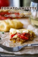 A straight-on view of a half eaten slice of a tomato galette that is layer with roasted tomatoes, gruyere cheese, and caramelized onions.